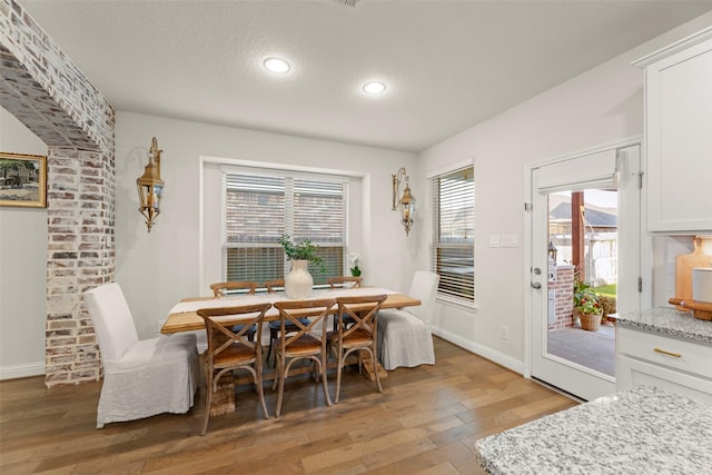 18731 Pilot Knolls Dr, Cypress, TX 77433 - dining space featuring light wood-type flooring, recessed lighting, baseboards, and a textured ceiling