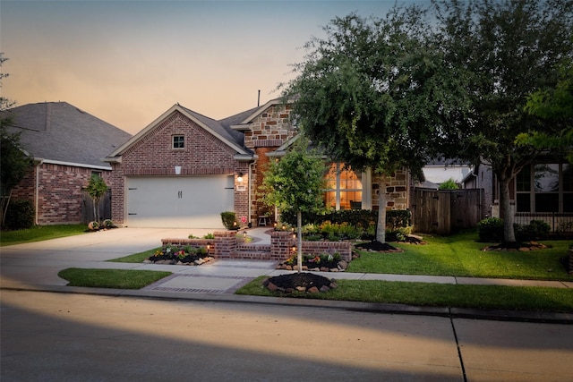 18731 Pilot Knolls Dr, Cypress, TX 77433 - view of front of home with concrete driveway, an attached garage, and brick siding