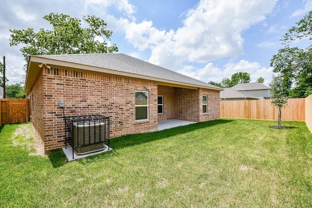 6718 Utah St, Houston, TX 77091 - back of house with brick siding, central AC unit, and a shingled roof