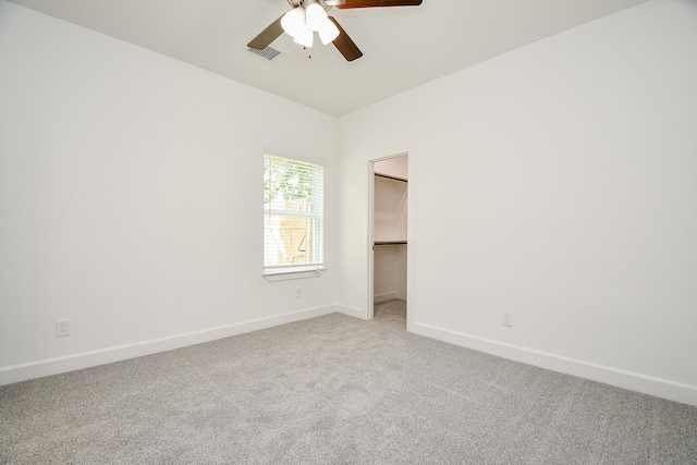 6727 Utah St, Houston, TX 77091 - spare room with a ceiling fan, light colored carpet, and baseboards