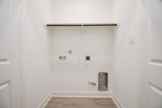 6727 Utah St, Houston, TX 77091 - washroom with gas dryer hookup, electric dryer hookup, washer hookup, and light wood-type flooring