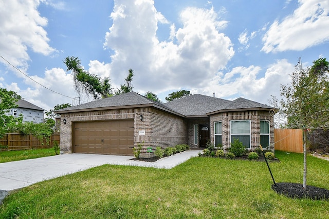 6519 Utah St, Houston, TX 77091 - view of front of home featuring brick siding, a garage, concrete driveway, and a shingled roof