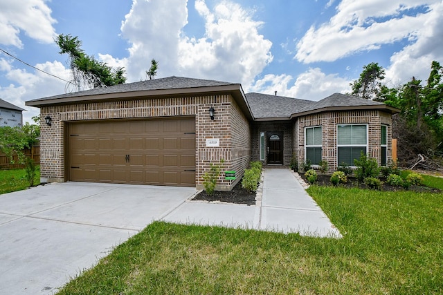 6519 Utah St, Houston, TX 77091 - single story home with brick siding, driveway, an attached garage, and a front lawn