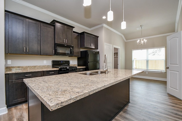 6519 Utah St, Houston, TX 77091 - kitchen featuring black appliances, ornamental molding, an island with sink, wood finished floors, and a chandelier
