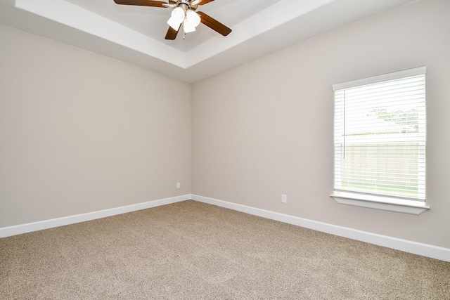 6519 Utah St, Houston, TX 77091 - unfurnished room with carpet flooring, a ceiling fan, baseboards, and a tray ceiling