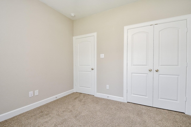 6519 Utah St, Houston, TX 77091 - unfurnished bedroom featuring carpet floors, a closet, and baseboards