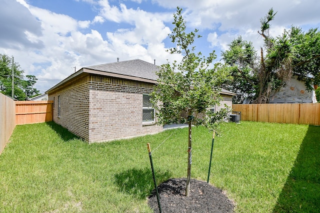 6519 Utah St, Houston, TX 77091 - rear view of property featuring brick siding and roof with shingles