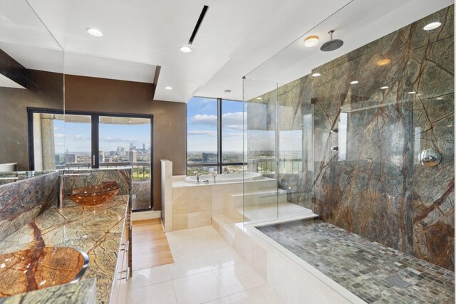 2001 Holcombe Blvd Unit Ph4, Houston, TX 77030 - bathroom featuring a marble finish shower, a garden tub, a view of city, vanity, and recessed lighting