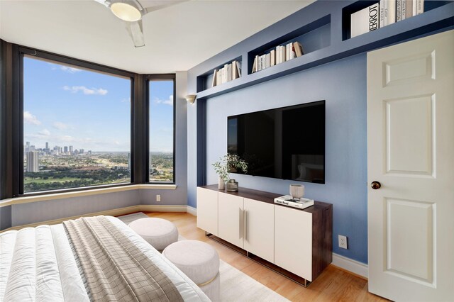 2001 Holcombe Blvd Unit Ph4, Houston, TX 77030 - bedroom featuring light wood-style flooring and baseboards