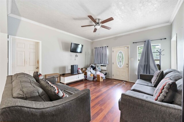 1206 Dewalt St, Houston, TX 77088 - living area with a ceiling fan, wood finished floors, ornamental molding, and a textured ceiling