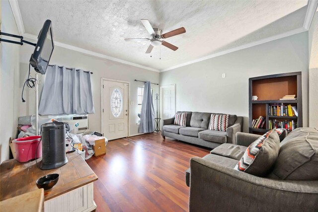 1206 Dewalt St, Houston, TX 77088 - living area with ceiling fan, wood finished floors, crown molding, and a textured ceiling