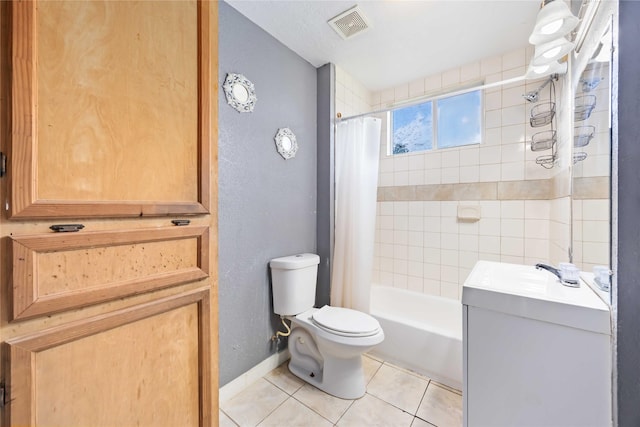 1206 Dewalt St, Houston, TX 77088 - bathroom with toilet, vanity, tile patterned floors, shower / bath combo with shower curtain, and baseboards