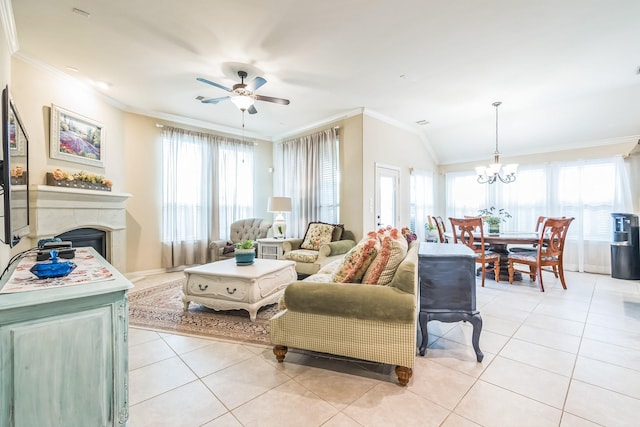 17915 Tall Chestnut St, Cypress, TX 77429 - living room with ornamental molding, light tile patterned floors, a chandelier, a ceiling fan, and a fireplace