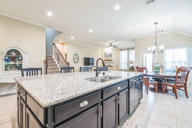 17915 Tall Chestnut St, Cypress, TX 77429 - kitchen with a sink, stainless steel dishwasher, an island with sink, ceiling fan, and open floor plan