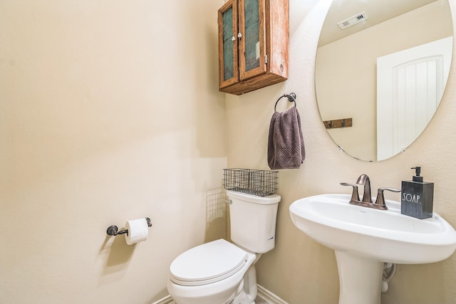 17915 Tall Chestnut St, Cypress, TX 77429 - bathroom featuring toilet, baseboards, and a sink