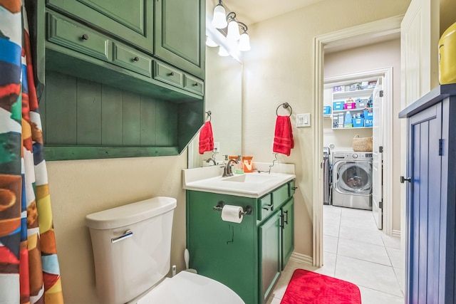 17915 Tall Chestnut St, Cypress, TX 77429 - bathroom with independent washer and dryer, tile patterned floors, vanity, and toilet
