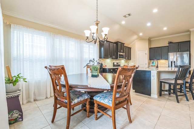 17915 Tall Chestnut St, Cypress, TX 77429 - dining room featuring a chandelier, crown molding, lofted ceiling, light tile patterned floors, and recessed lighting