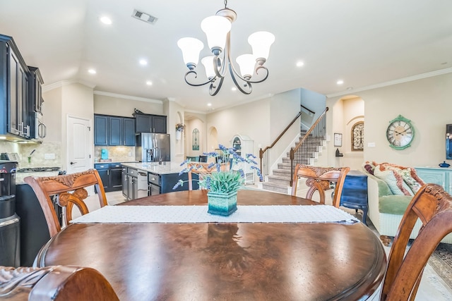 17915 Tall Chestnut St, Cypress, TX 77429 - dining space with arched walkways, a chandelier, stairway, ornamental molding, and recessed lighting