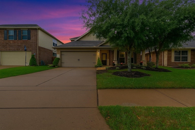17915 Tall Chestnut St, Cypress, TX 77429 - view of front facade with concrete driveway, a yard, and brick siding