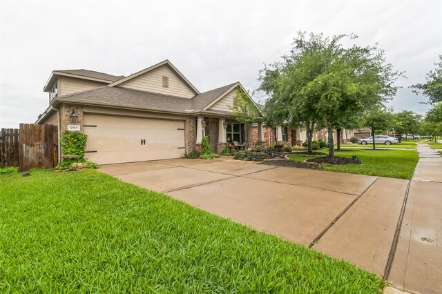 17915 Tall Chestnut St, Cypress, TX 77429 - view of front of home with a garage, brick siding, concrete driveway, and roof with shingles
