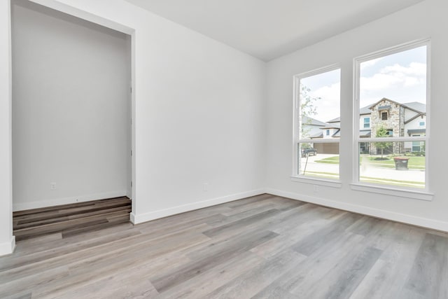 21118 Chelton Beach Dr, Cypress, TX 77433 - unfurnished room featuring wood finished floors and baseboards
