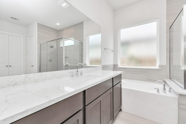 21118 Chelton Beach Dr, Cypress, TX 77433 - full bathroom featuring a bath, vanity, and a stall shower