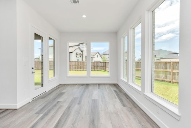 21118 Chelton Beach Dr, Cypress, TX 77433 - unfurnished sunroom with baseboards, wood finished floors, and recessed lighting