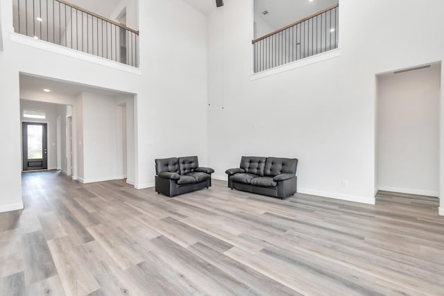 21118 Chelton Beach Dr, Cypress, TX 77433 - unfurnished room with a towering ceiling, wood finished floors, and baseboards