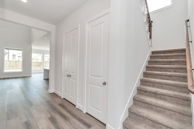21118 Chelton Beach Dr, Cypress, TX 77433 - stairway with wood finished floors, recessed lighting, and baseboards