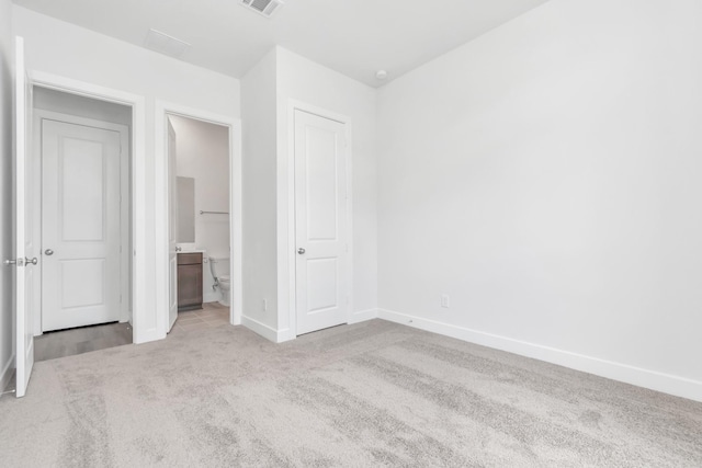 21118 Chelton Beach Dr, Cypress, TX 77433 - unfurnished bedroom featuring carpet floors, baseboards, and ensuite bath