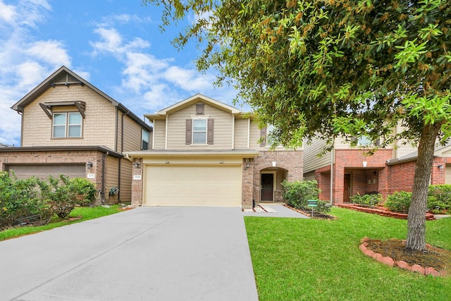 16350 Oakside Hollow Ln, Houston, TX 77084 - view of front of house featuring an attached garage, driveway, a front yard, and brick siding