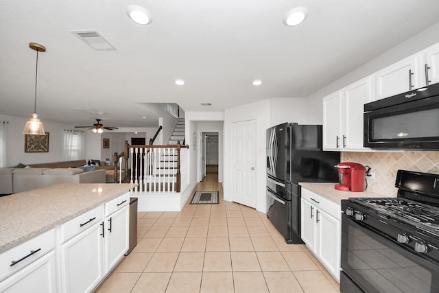 16350 Oakside Hollow Ln, Houston, TX 77084 - kitchen featuring black appliances, decorative backsplash, light tile patterned floors, white cabinetry, and recessed lighting