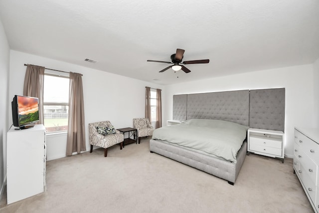 16350 Oakside Hollow Ln, Houston, TX 77084 - bedroom with light colored carpet, multiple windows, and ceiling fan