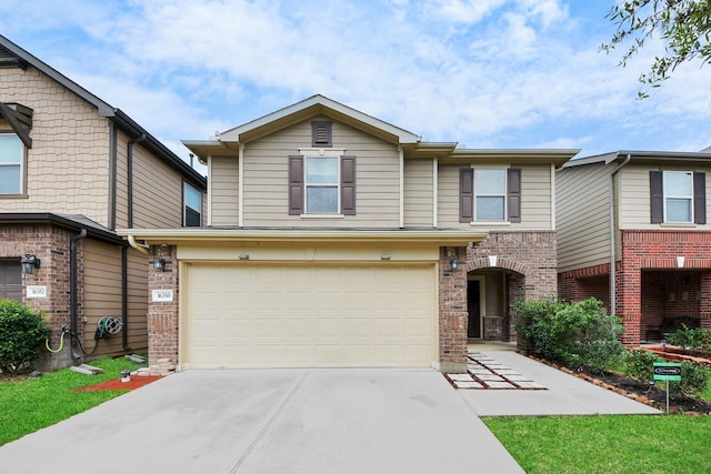 16350 Oakside Hollow Ln, Houston, TX 77084 - view of front of home with driveway, a garage, and brick siding