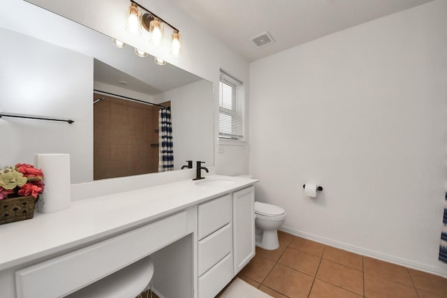16350 Oakside Hollow Ln, Houston, TX 77084 - full bath featuring toilet, vanity, tile patterned flooring, a shower with shower curtain, and baseboards