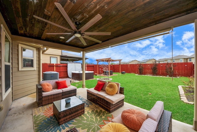16350 Oakside Hollow Ln, Houston, TX 77084 - view of patio / terrace featuring central AC, ceiling fan, a hot tub, and an outdoor hangout area