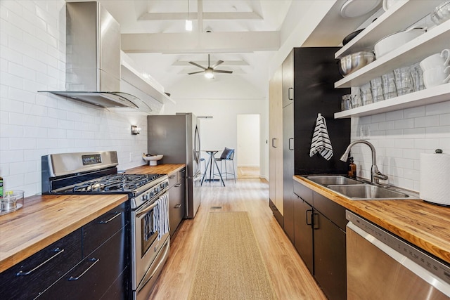 542 Arlington St, Houston, TX 77007 - kitchen with butcher block countertops, stainless steel appliances, wall chimney exhaust hood, and a sink