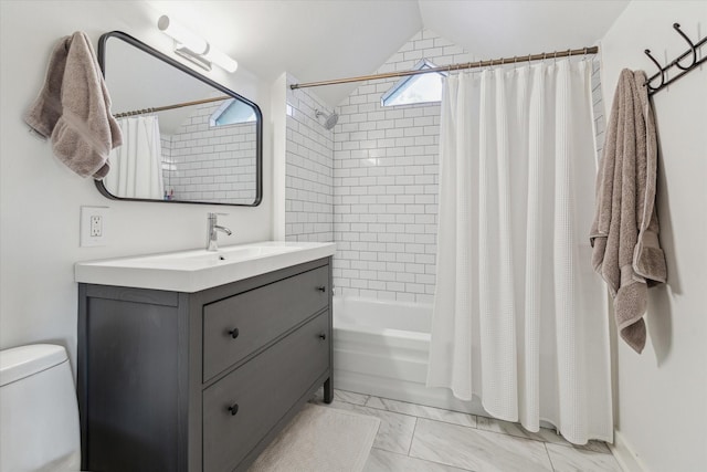542 Arlington St, Houston, TX 77007 - full bath with marble look tiles, vanity, shower / bath combo, lofted ceiling, and toilet