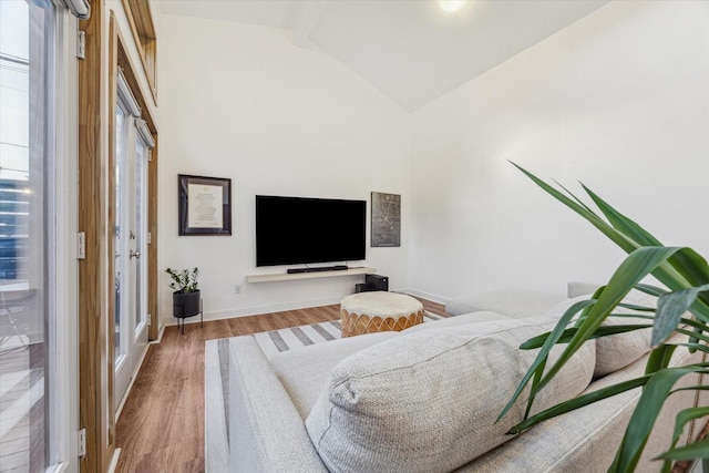 542 Arlington St, Houston, TX 77007 - living area featuring wood finished floors, baseboards, and high vaulted ceiling