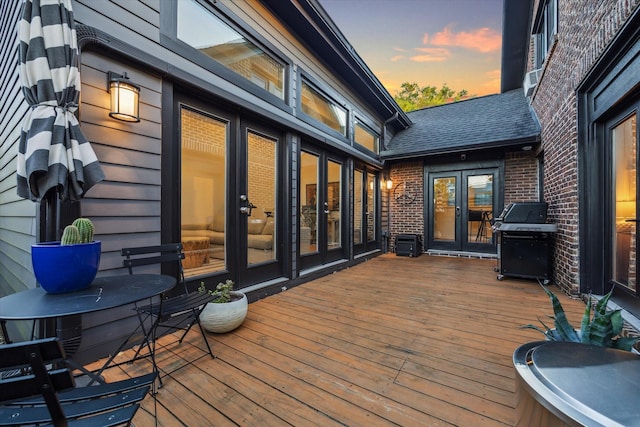 542 Arlington St, Houston, TX 77007 - deck at dusk featuring french doors and grilling area