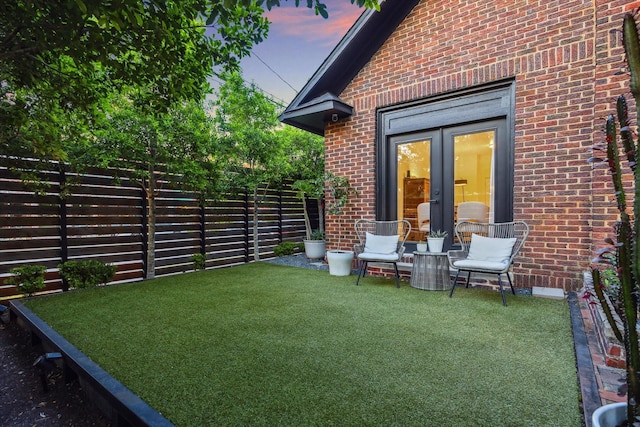 542 Arlington St, Houston, TX 77007 - yard at dusk featuring french doors