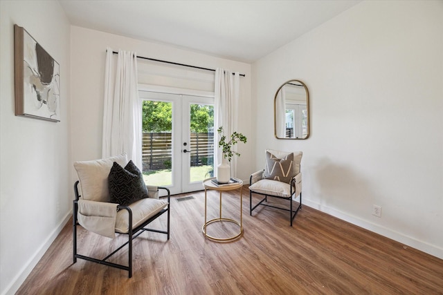 542 Arlington St, Houston, TX 77007 - sitting room featuring french doors, wood finished floors, and baseboards