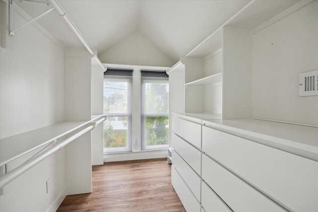 542 Arlington St, Houston, TX 77007 - walk in closet featuring vaulted ceiling and light wood-style floors