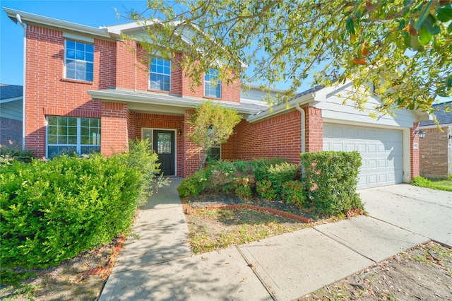 6610 Autumn Sunset Ln, Spring, TX 77379 - traditional-style home with brick siding, an attached garage, and driveway
