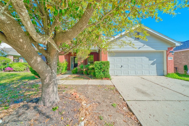 6610 Autumn Sunset Ln, Spring, TX 77379 - obstructed view of property with brick siding, an attached garage, and driveway