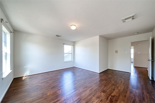 6610 Autumn Sunset Ln, Spring, TX 77379 - empty room featuring dark wood finished floors and baseboards