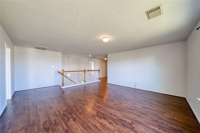 6610 Autumn Sunset Ln, Spring, TX 77379 - unfurnished room featuring a textured ceiling, wood finished floors, and baseboards