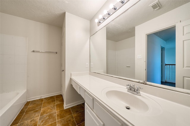 6610 Autumn Sunset Ln, Spring, TX 77379 - full bathroom featuring vanity, a textured ceiling, and baseboards