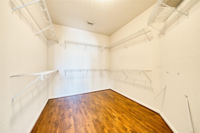 6610 Autumn Sunset Ln, Spring, TX 77379 - walk in closet featuring wood finished floors