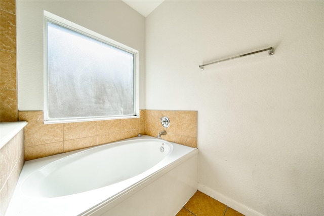 6610 Autumn Sunset Ln, Spring, TX 77379 - bathroom featuring a garden tub and tile patterned flooring